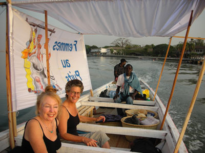 Catherine, Vijali, Boniface, Honré in our pirogue with banner 